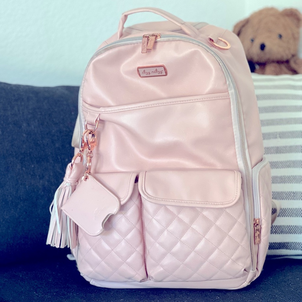 Itzy Ritzy pink champagne backpack w/ changing pad.